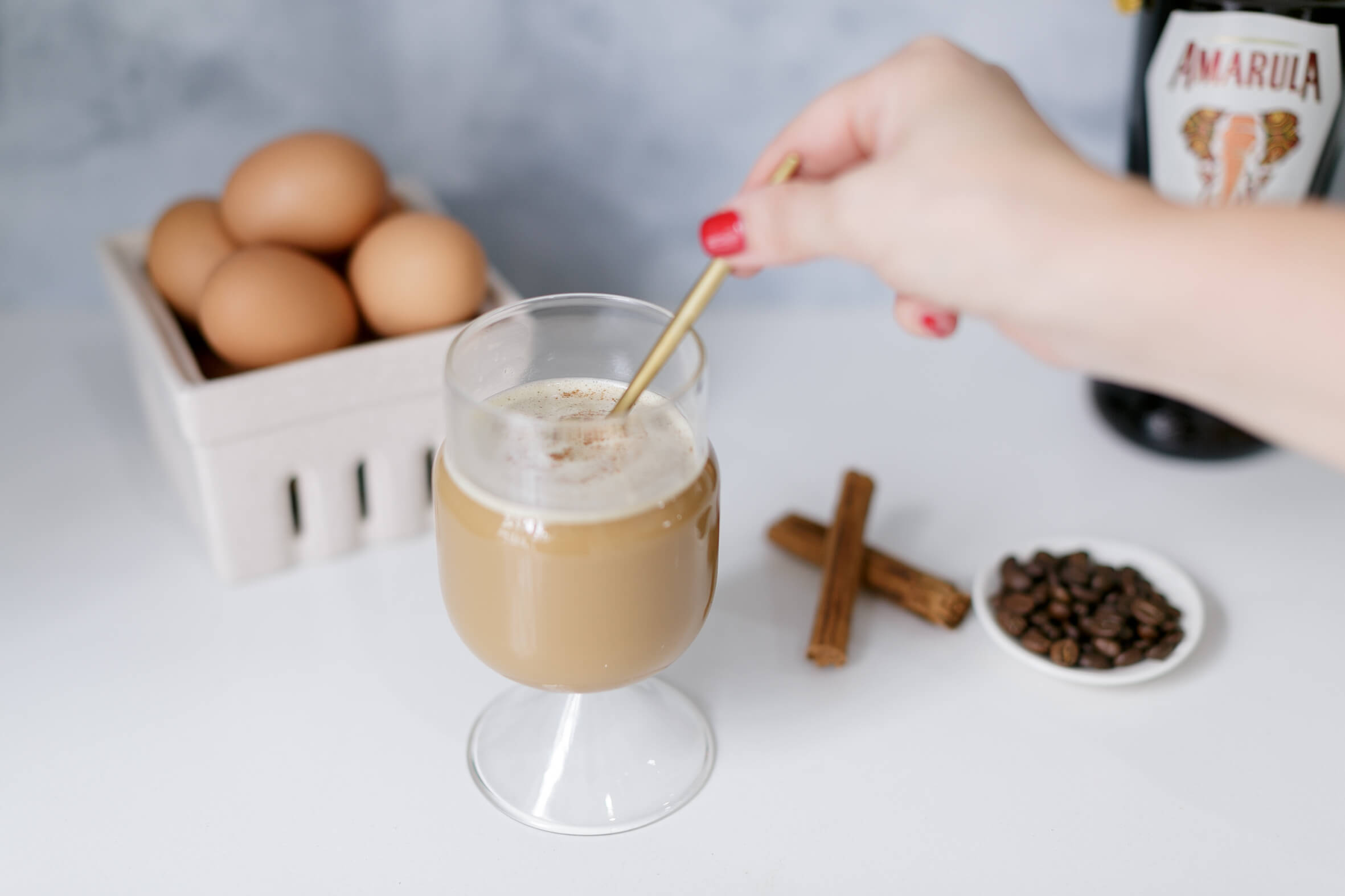 Viernamese Egg Coffee stirred with a golden spoon